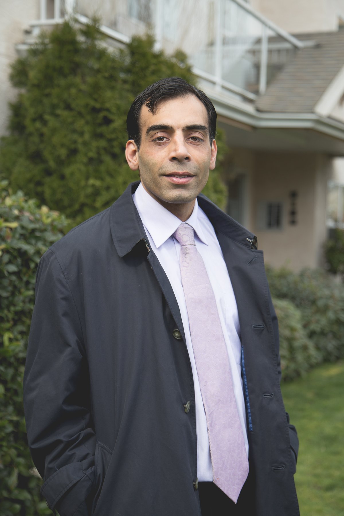 Faizal Charania outside a home in the Cowichan Valley